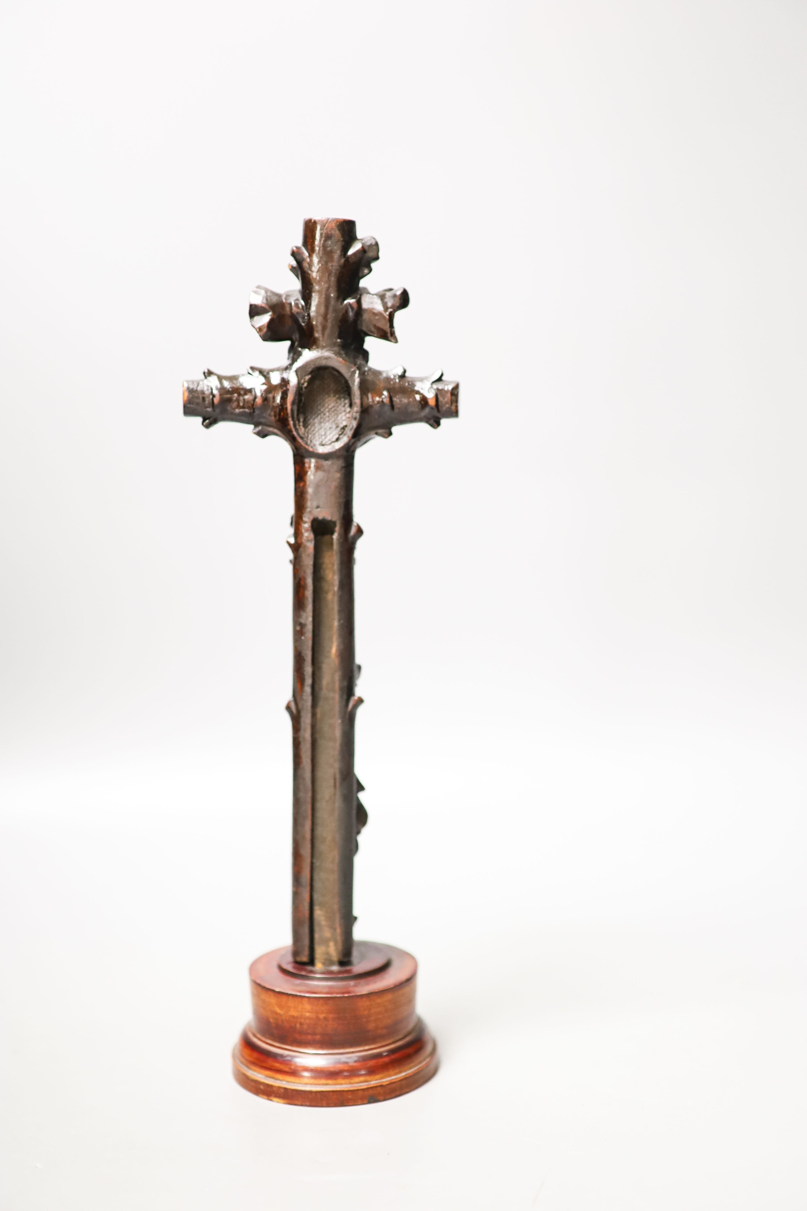 A carved wood crucifix 33cm